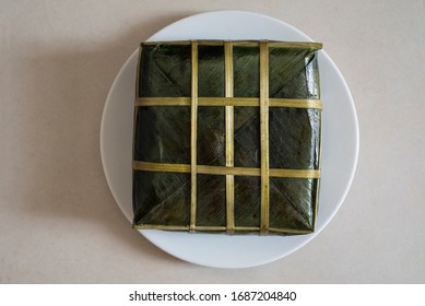 Top Close-up View Of A Vietnamese Tet Rice Cake In A White On A White Table