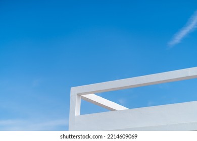 Top Corner Of A Building With Negative Space Of The Sky