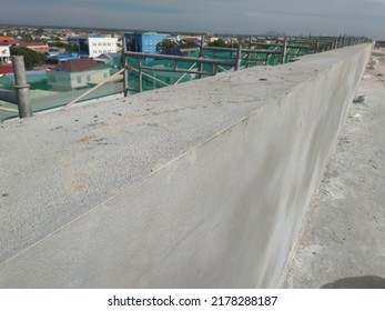 The Top Of The Corner Of The Parapet Wall After Plastering Is Completed.