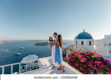 Top Destination In Europe, Santorini, Greece. Family On Vacation On Santorini, Greece