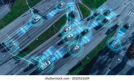 Top Down Aerial Drone: Autonomous Self Driving Cars Moving Through City. Concept: Artificial Intelligence Scans Surrounding Environment, Detecting Cars, Avoids Traffic Jams and Drives Safely.