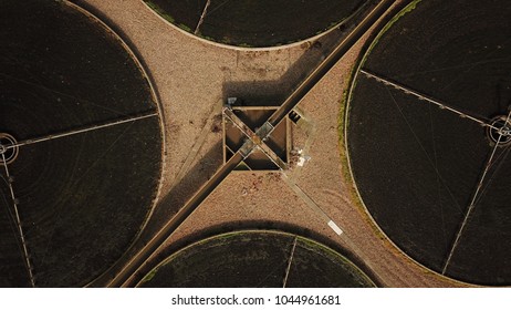 Top Down Aerial Drone Image Of A Sewage Treatment (water Reclamation) Plant In Guildford, England On A Sunny Day.