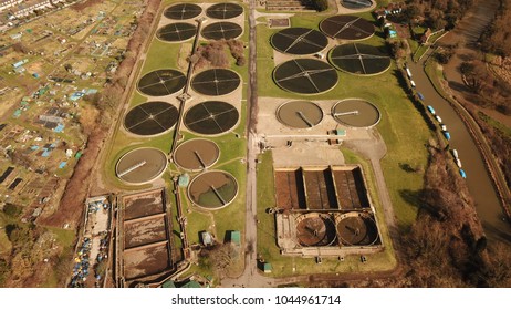 Top Down Aerial Drone Image Of A Sewage Treatment (water Reclamation) Plant In Guildford, England On A Sunny Day.