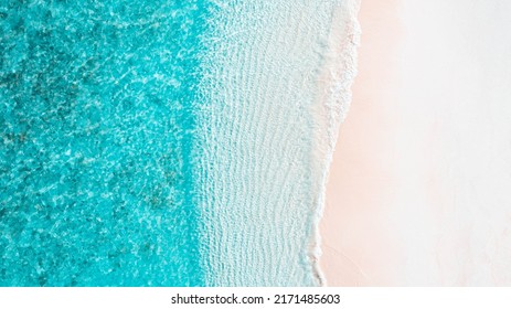 Top Down Aerial Drone Image of Shoreline in Maldives. Bright Blue Crystal Clear Water and White Sandy beach. beautiful paradise tropical  island. Summer and travel vacation 