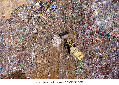 Top down aerial image of a Municipal Solid waste Landfill during collecting, sorting and pressing work.