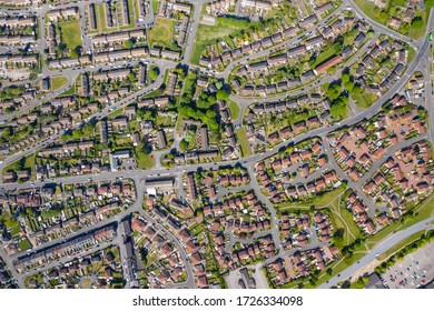 Top down aerial photo of the British town of Middleton in Leeds West Yorkshire showing typical suburban housing estates with rows of houses, taken on a bright sunny day using a drone.  - Shutterstock ID 1726334098