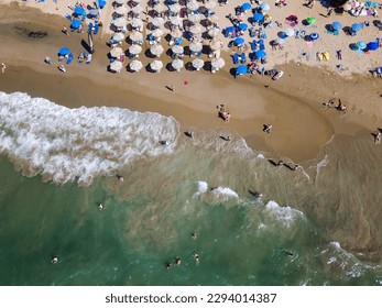 Top down aerial view of a busy beach with sun umbrellas (Nea Chora, Chania, Crete) - Shutterstock ID 2294014387