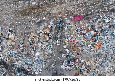 Top down aerial view to the city dump. World ecological problem. Drone photography. A lot of plastic garbage.