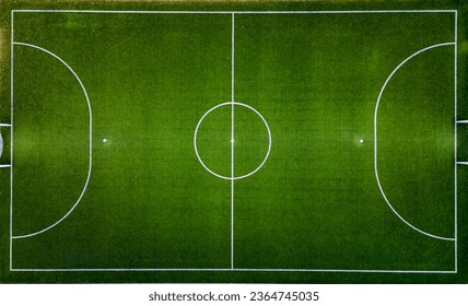 Top down aerial view of an empty soccer field, awaiting the joyous moments of the game.