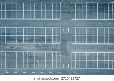 Top down aerial view of empty asphalt parking lot with white lines background.