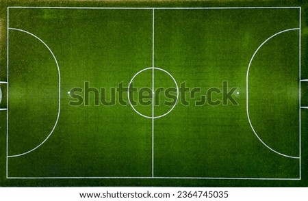 Top down aerial view of an empty soccer field, awaiting the joyous moments of the game.