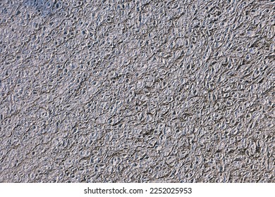 Top down aerial view of expansive area of circular or rounded snow and ice chunks coined "ice pancakes" sitting on the cold waters of Lake Michigan creating a fantastic winter or textured background. - Powered by Shutterstock