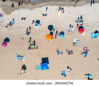 Top Down Aerial View Of People Relaxing On The Sand In Virginia Beach