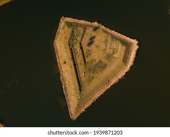 Top Down Aerial View Of The Small Island With Some Sheep In The Heusden, The Netherlands 