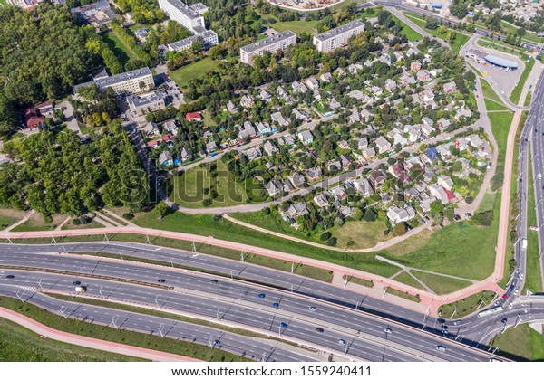 top down aerial view of suburb residential area in sunny\
summer day 