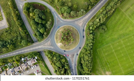 Top Down Aerial View Of A Traffic Roundabout On A Main Road In An Urban Area Of The UK