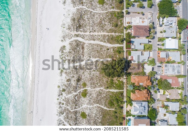 Top down Angle of\
houses on the shore