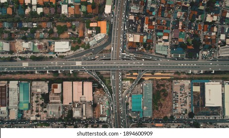 Top down cars drive at cross freeway in aerial view. Highway traffic transportation at Manila city on Luzon Island, Philippines, Asia. Wonderful cityscape of downtown centre - Shutterstock ID 1894600909