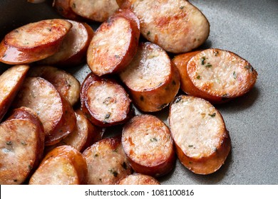 Top Down Close Up On Golden Brown Breakfast Sausage Slices, Cooking In A Nonstick Frying Pan