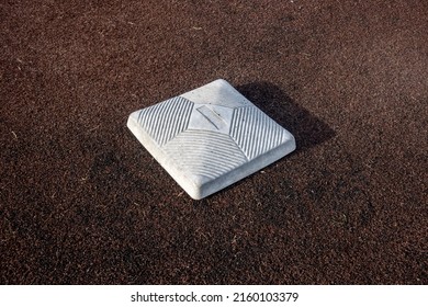 Top Down, Close Up View Of A Base On A Clean Baseball Field On A Bright, Sunny Day