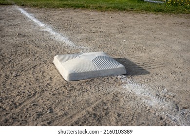 Top Down, Close Up View Of A Base On A Clean Baseball Field On A Bright, Sunny Day