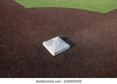 Top Down, Close Up View Of A Base On A Clean Baseball Field On A Bright, Sunny Day