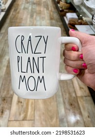 The Top Down, Close Up View Of A Woman Holding A Coffee Mug That Reads 