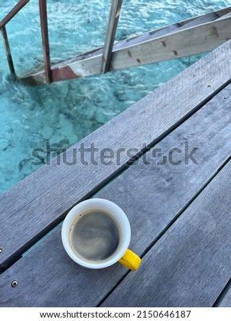 Top Down Coffee on Deck in Ocean Overwater Bungalo