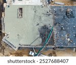 Top down of a concrete slab being poured