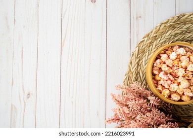 Top Down Flatlay, With Flavored Popcorn In A Bowl, Dried Flowers, And Rattan Placement Useful For Cozy Autumn And Fall Snacking Concept Projects