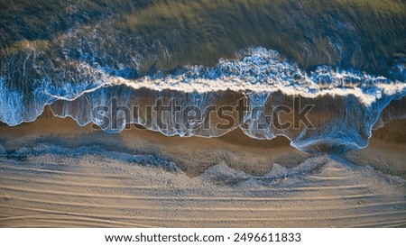 Similar – Aerial Drone View Of Blue Ocean Waves And Beautiful Sandy Beach Shore in Portugal