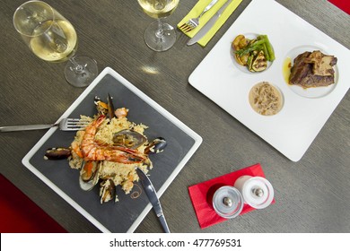 Top Down Overhead View Of Steak And Lobster Dinner For Two.