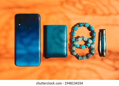 Top Down Photo Of Every Day Carry Items, Edc, Phone Card Holder, Bracelet, Knife.