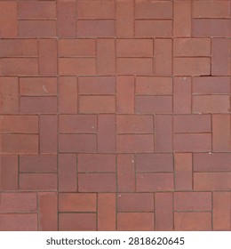 Top down seamless texture map featuring terracotta red bricks arranged in a classic basketweave pavement pattern.