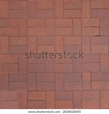 Top down seamless texture map featuring terracotta red bricks arranged in a classic basketweave pavement pattern.
