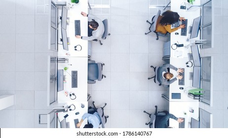 Top Down Shot Of Big Busy Corporate Office With Tow Rows Off Businessmen And Businesswomen Working On Desktop Computers. Bright Open Space Office With Businesspeople And Salespeople