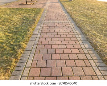 A Top Down Shot Of A Brick Walk Way.