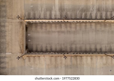 a top down shot over an empty, paved parking lot with multiple levels. It was sunset and the mall was closed.