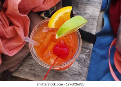 Top Down Shot Of A Rum Punch On A Wooden Table With Beach Gear, Anguilla, BWI.