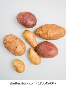 Top Down Shot Of Three Different Types Of Raw Potatoes