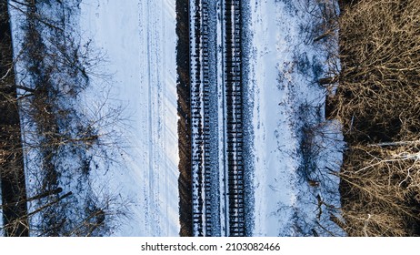 Top Down View, Aerial Over Snowy Train Tracks