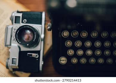 Top Down View Of Analog Camera And Vintage Typewriter Keyboard On Wooden Table