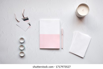 Top Down View Of A Blank Notebook On A Desk With A Candle.