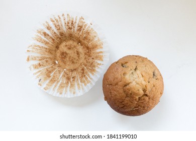 Top Down View Of Blueberry Muffin Outside Its Wrapper. Isolated On A White Background.