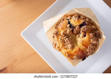 A Top Down View Of A Blueberry Muffin.