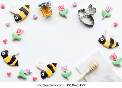 Top Down View Of A Border Of Sugar Cookies In Shapes Of Bees, Tulips And Hearts. A Spring And Summer Concept.