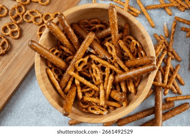 A top down view of a bowl of assorted gluten-free pretzels.