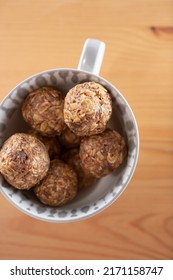 A Top Down View Of A Bowl Of Date Energy Balls.