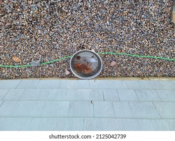 A Top Down View Of A Bucket With Frozen Water In It.