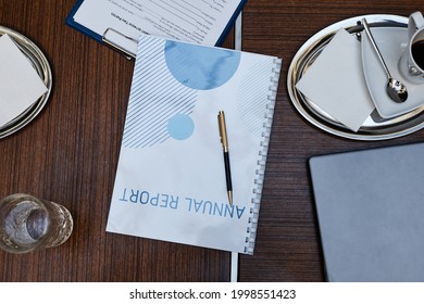 Top Down View At Business Report And Acessories At Meeting Table, Copy Space